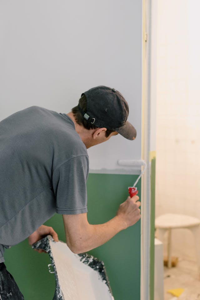 man painting a wall